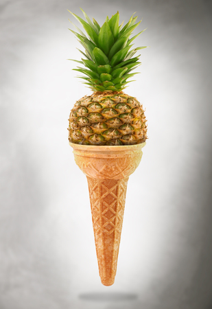 a Delicious ice cream cone with pineapple tasteの写真素材