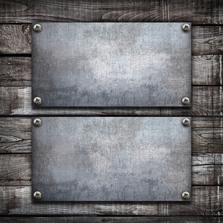 an industrial metal plate on a wooden backgroundの写真素材