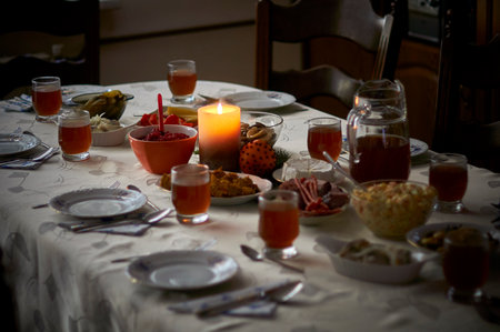 a candle burning on the set table