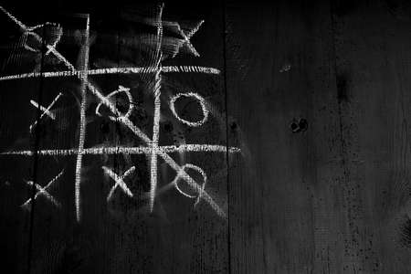 old planks damaged by worms, shown up close, doors painted black, planks joined togetherの写真素材