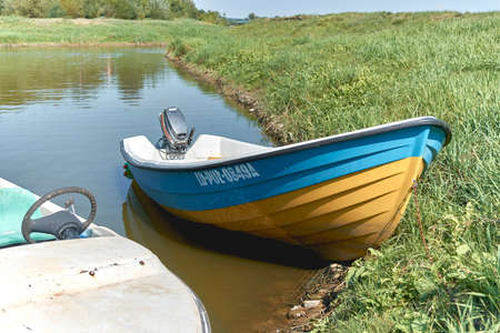 old wooden boat, boat moored on the river,