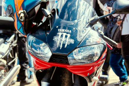 ZwoleÅ„, Masovian Voivodeship, Poland - April 10, 2022. Parking of motorbikes and cars. Group...
