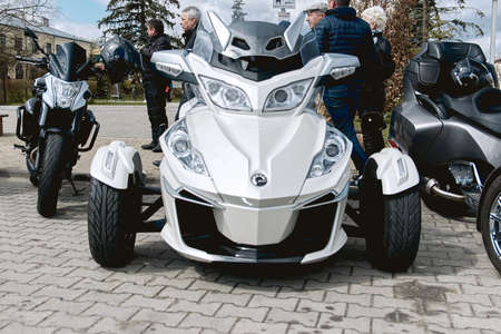 ZwoleÅ, Masovian Voivodeship, Poland - April 10, 2022. Parking of motorbikes and cars. Group present Motorbike showsation.のeditorial素材