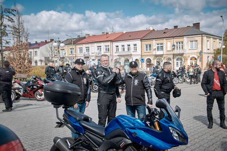 ZwoleÅ, Masovian Voivodeship, Poland - April 10, 2022. Parking of motorbikes and cars. Group present Motorbike showsation.のeditorial素材