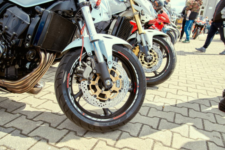 ZwoleÅ„, Masovian Voivodeship, Poland - April 10, 2022. Parking of motorbikes and cars. Group...