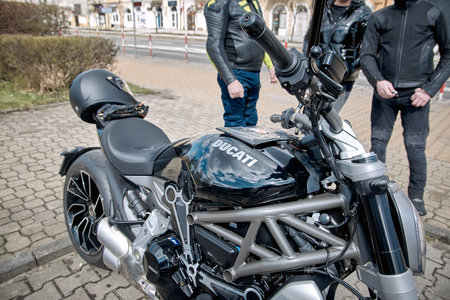 ZwoleÅ, Masovian Voivodeship, Poland - April 10, 2022. Parking of motorbikes and cars. Group present Motorbike showsation.のeditorial素材