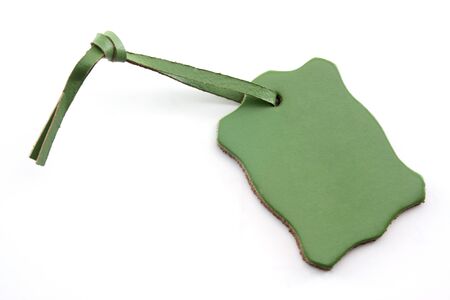 Leather Green Tag on White Background with Copy Space.の写真素材