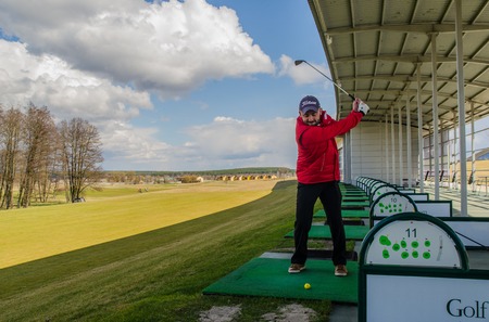 KIEV, UKRAINE - MARCH 29: Golf instructor befor the blow in Kiev golf club "Golfstreem". 29 March 2015 Kiev. Ukraineのeditorial素材