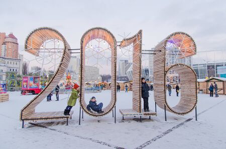 Kiev  Ukraine - January 2016: The wooden figures of new coming year - 2016 as a place for taking...