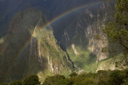 A rainbow over Machu Picchu Valley in Peru, South Americaの写真素材
