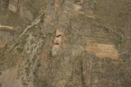 A Rock face of Inca God in Ollantaytambo ruins near Machu Picchu, Peru, South Americaの写真素材