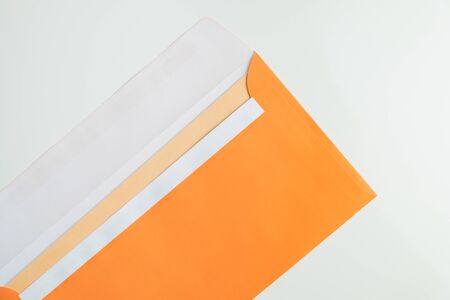 Open envelope in white background, top view. Abstract image of postal package, concept of...