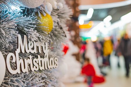 Merry Christmas sign at a public place, detailed view. New Year holidays at a city mall or shopping centreの写真素材