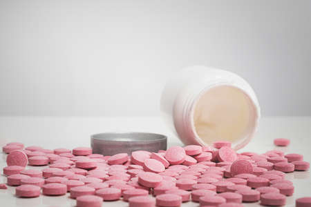 Pile of tablets in white background. Concept of prescription medicine, vitamins, nutritional supplements of drug abuseの写真素材