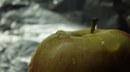 Homemade apple with water dropletsの写真素材