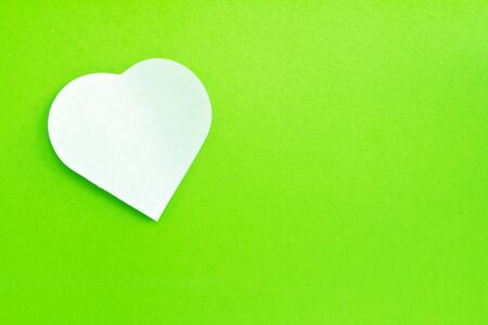 White note paper attached on green background の写真素材