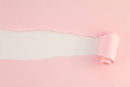 pink teared paper with copy space の写真素材
