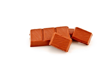 Broken chocolate bar on a white background 
の写真素材