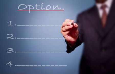 business man writing option list. の写真素材