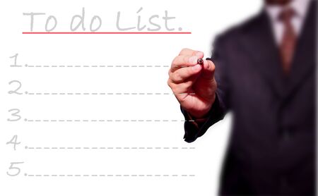 business man hand checking the to do list.の写真素材