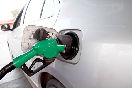 Pumping gas at gas pump 