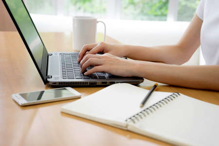 business, technology and internet concept - the girl at the computer manager