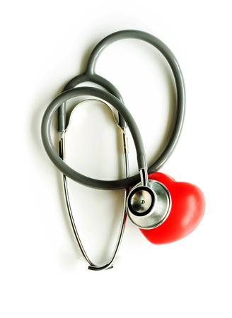 Medical stethoscope and heart isolated on white.の写真素材