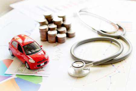 stethoscope car graph and coinの写真素材