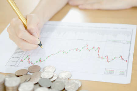 Summary report and financial analyzing concept, Pen and coinsの写真素材