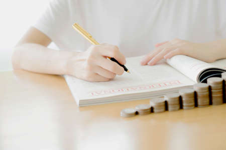 Woman writing on paperの写真素材