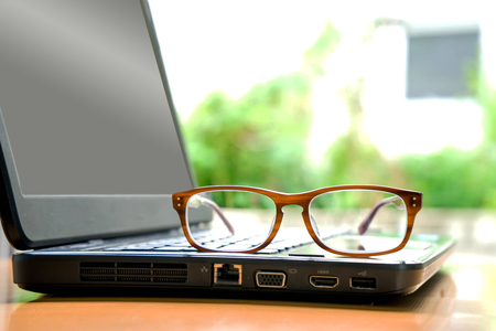 Glasses on laptopの写真素材
