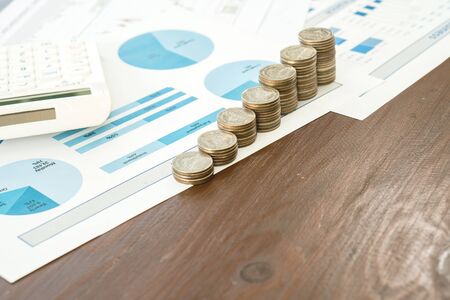 Graph with calculator and coins