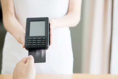 Close up of customer paying by credit card
