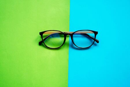 Glasses on two color pastel backgroundの写真素材
