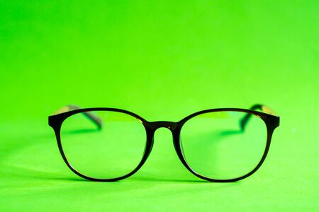 Glasses on a green backgroundの写真素材