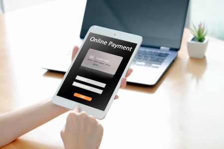 Online banking on smartphone with businessman showing screenの写真素材