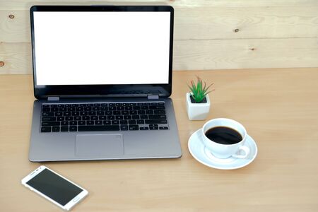 Laptop computer, phone and coffeeâの写真素材