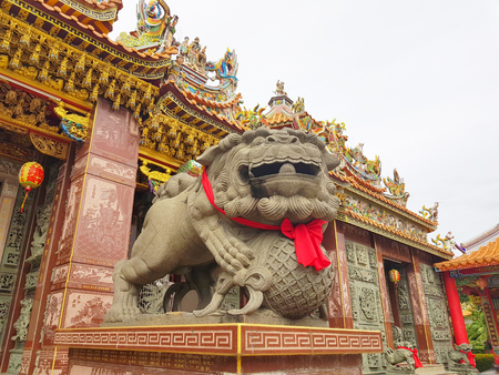 Lion marble head in front of an ancient architecture in chinese templeのeditorial素材