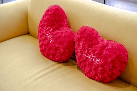 Heart shape pillow on sofa. Valentines day love.の写真素材
