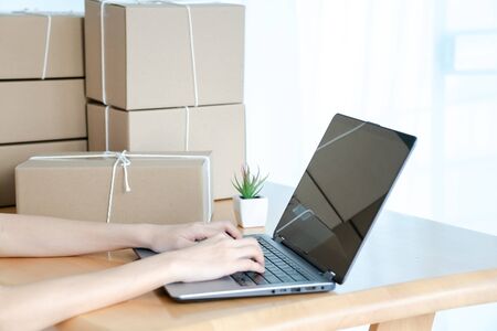 Asian women working laptop computer selling online start up small business owner.の写真素材