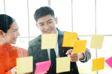 Group of business people are in the office brainstorming and working on some new business ideas.