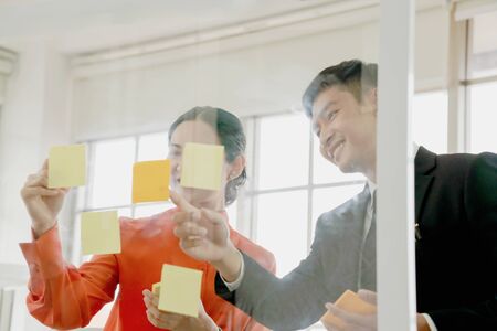 Business people writing creative notesの写真素材