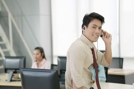 Asia call center workers or Confident business with headset,Customer support standing
