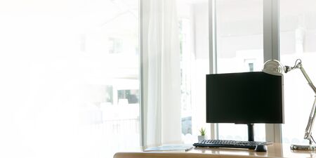 Business work desk with computer and keyboard modern office background.