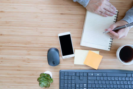 Overhead View Of Businessman Working At Computer In Office. Business conceptの写真素材