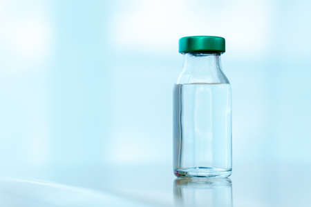 Close up vaccines fight against virus, doctor or scientist in laboratory holding a syringe with liquid vaccines. Concept : diseases,medical care.の写真素材