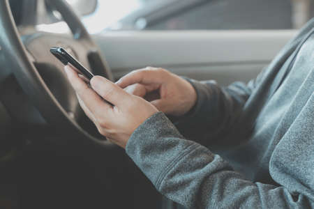 close up of asian man use smartphone in the car,  talking, modern GPS navigation, communication...
