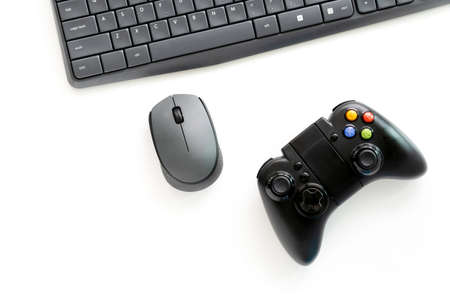 computer keyboard, mouse and game console with joystick controller isolated on white background for operate computer and gaming,の写真素材