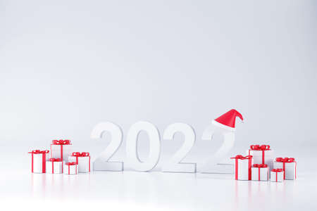 3D. 2022 font, Santa Claus hat and gift box At Christmas and New Year on a white backgroundの写真素材