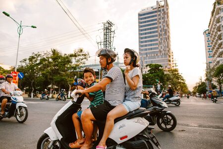 Family on motorbike on the roadway. Nha chang. May 24, 2015のeditorial素材
